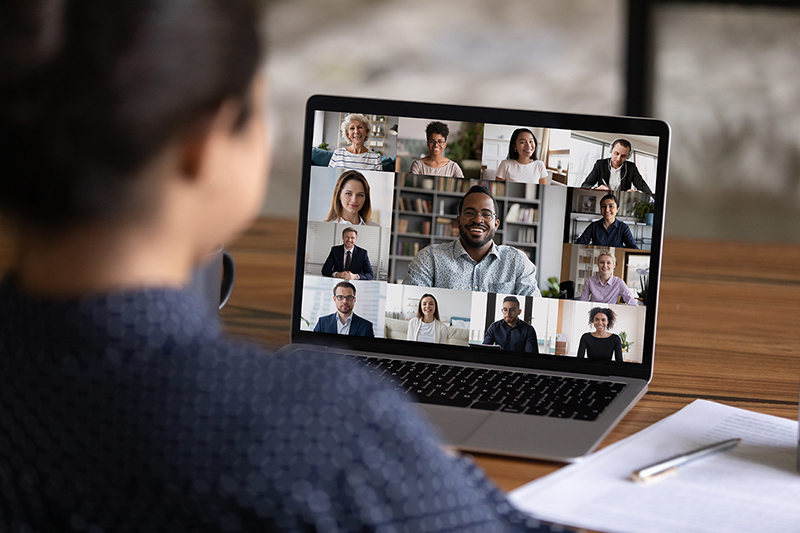 Photo of woman participating in virtual meeting